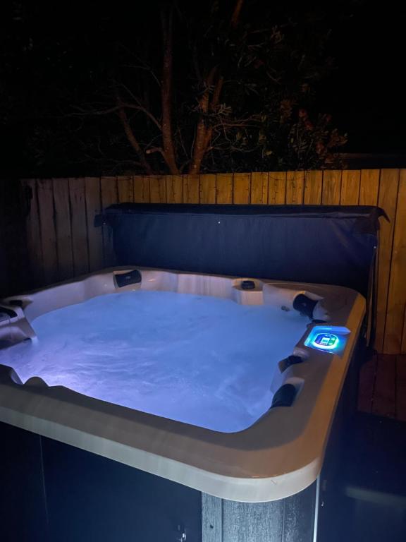 a jacuzzi tub at night with at Great for Couples - Families - Groups in Mangawhai