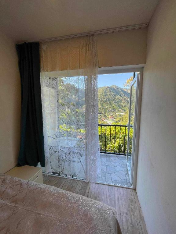Postel nebo postele na pokoji v ubytování Borjomi View