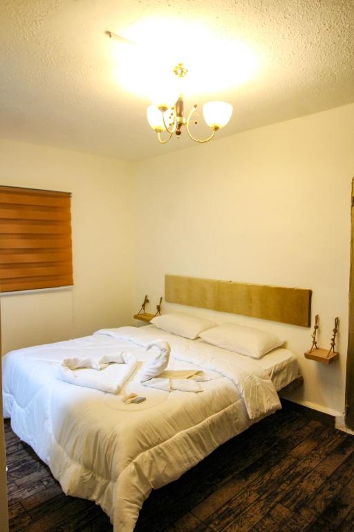 Postel nebo postele na pokoji v ubytování Petra NefNaf Hostel