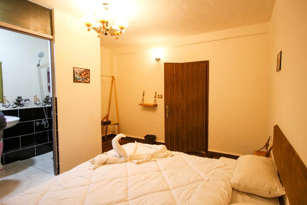 Postel nebo postele na pokoji v ubytování Petra NefNaf Hostel