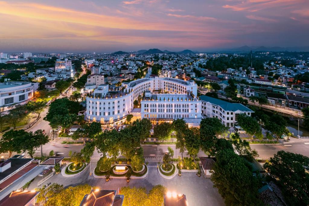 an aerial view of a city at night at Silk Path Grand Hue Hotel in Hue