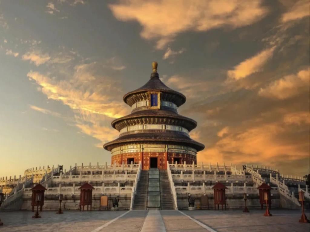 a large building with a tower on top of it at Happy Dragon City Center Alley Hotel -In the city center with big window&heater, ticket service&Free Coffee&Food recommendation,Near Tian Anmen Forbiddencity,Easy to get traditional Walking area&Shichahai in Beijing