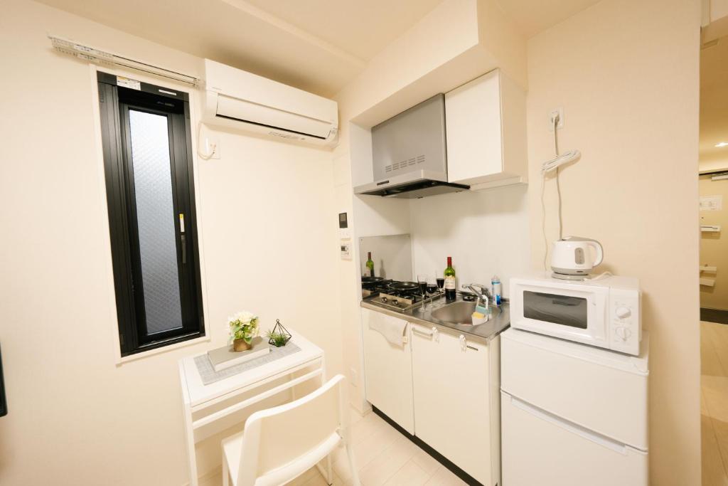 Kuchyň nebo kuchyňský kout v ubytování FL Residence Shinjuku II