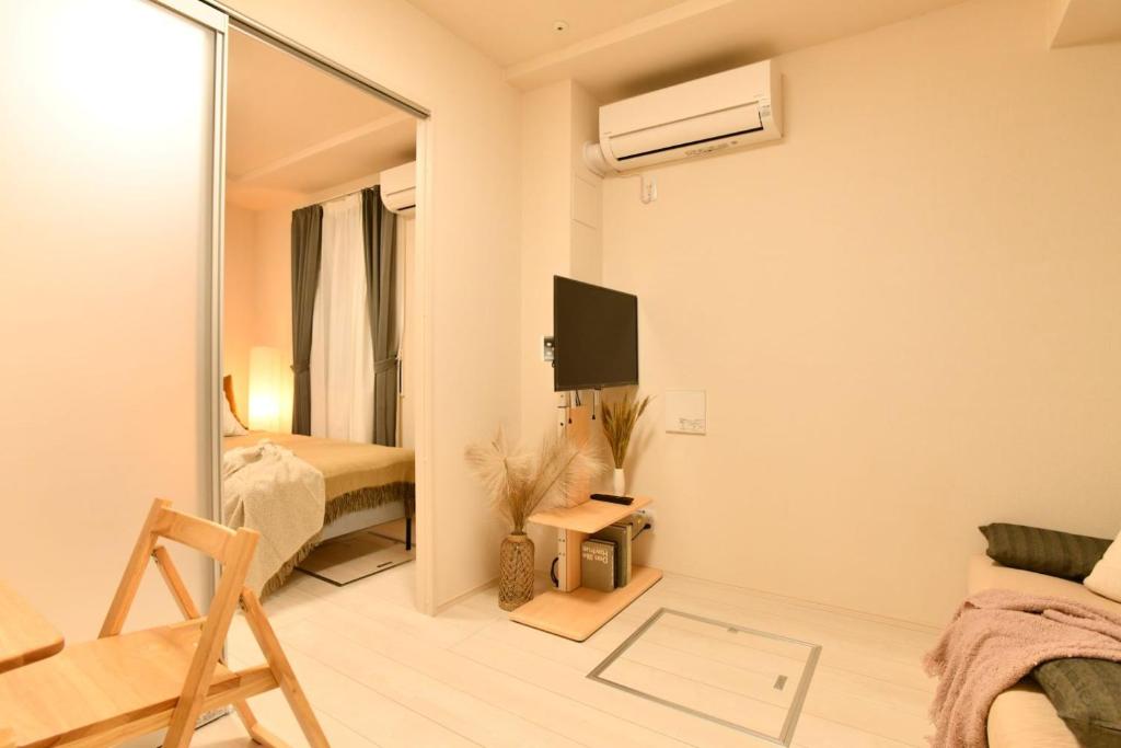 TV a/nebo společenská místnost v ubytování FL Residence Shinjuku II