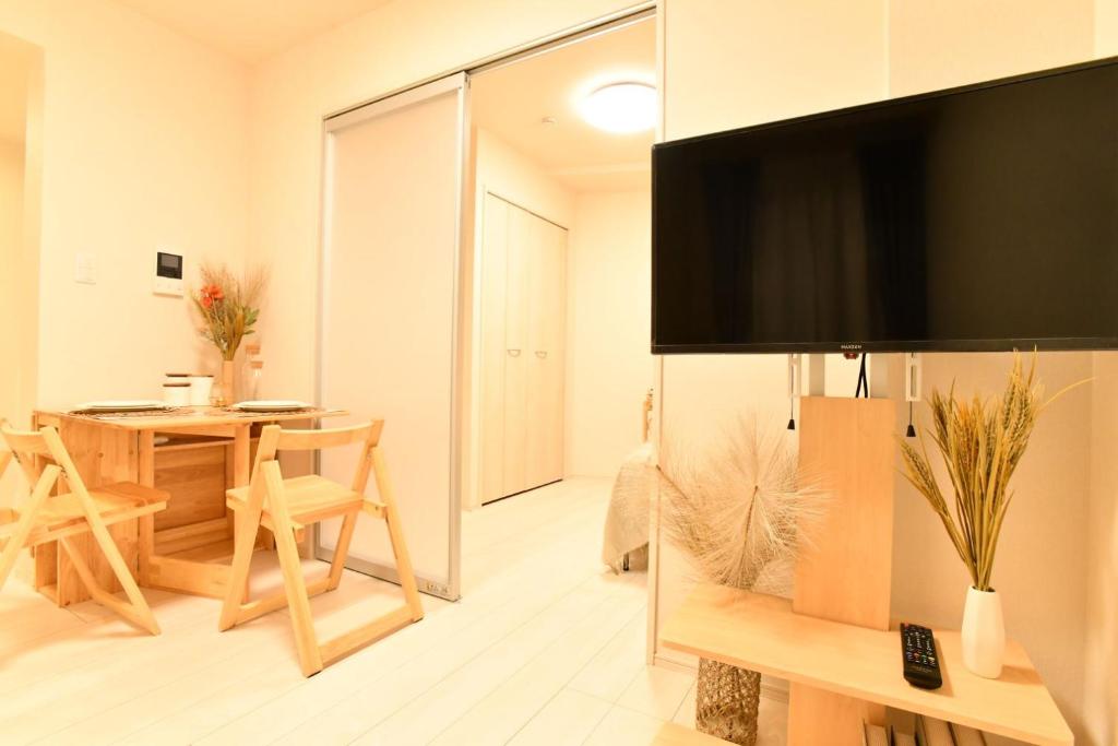 TV a/nebo společenská místnost v ubytování FL Residence Shinjuku II