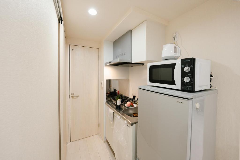 Kuchyň nebo kuchyňský kout v ubytování FL Residence Shinjuku II