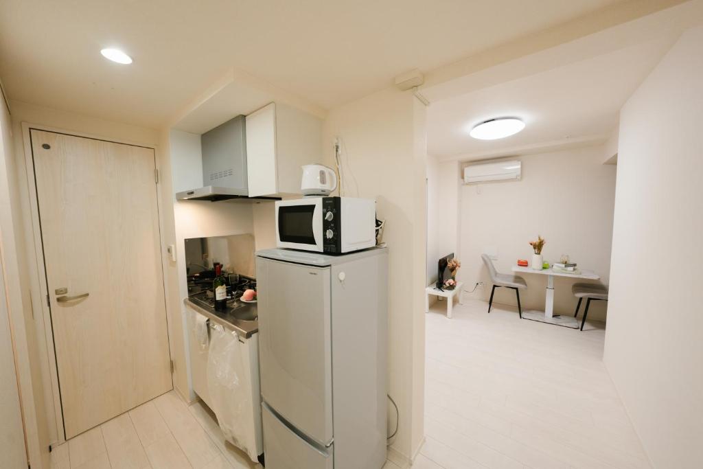 Kuchyň nebo kuchyňský kout v ubytování FL Residence Shinjuku II