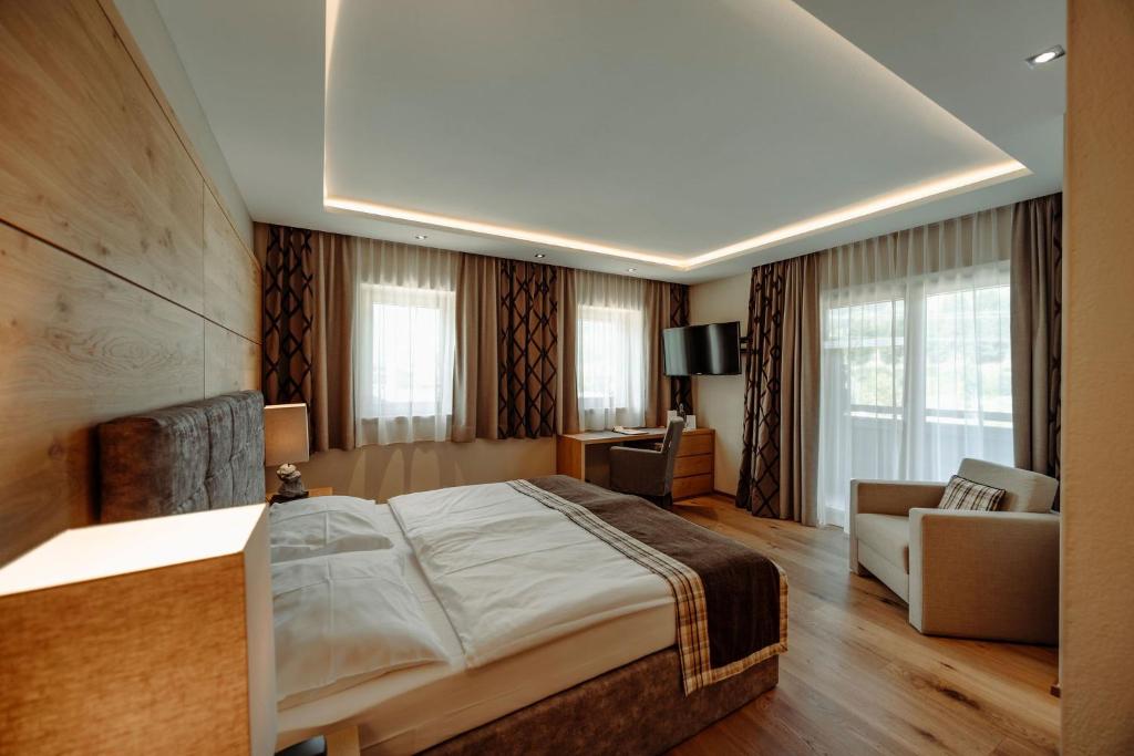 Postel nebo postele na pokoji v ubytování Das gemütliche Dorfhotel Kaltenhauser
