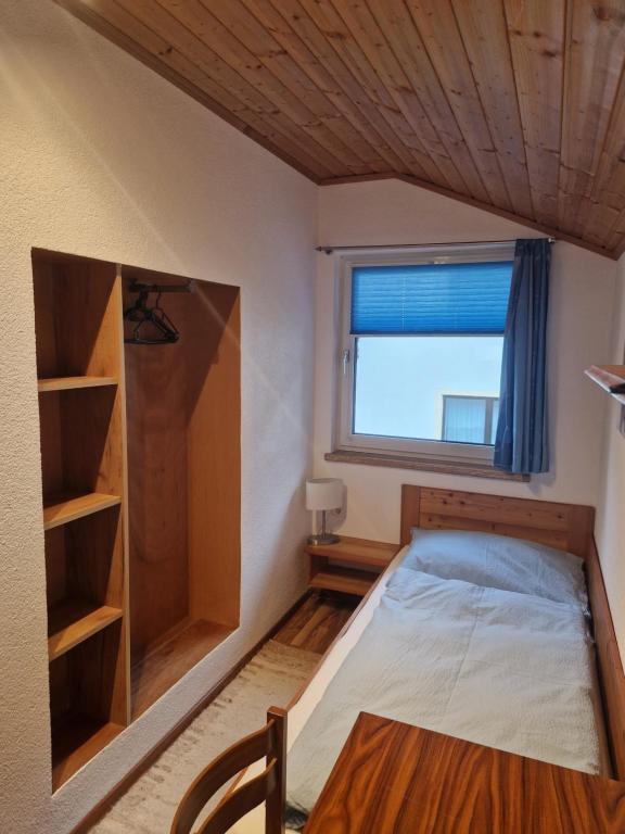 Postel nebo postele na pokoji v ubytování Haus Talblick