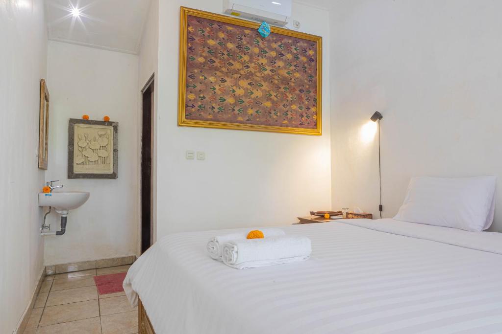 Postel nebo postele na pokoji v ubytování Shankara Accomodation Ubud