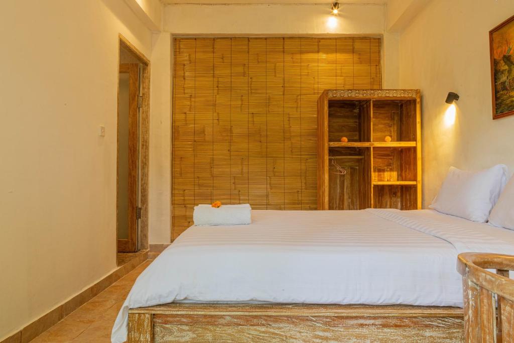 Postel nebo postele na pokoji v ubytování Shankara Accomodation Ubud