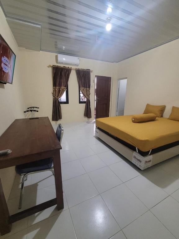Posezení v ubytování Solo Nadamax City Guest House Syariah