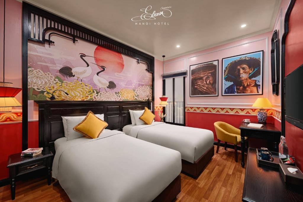 Postel nebo postele na pokoji v ubytování Eliana Signature Hanoi Hotel