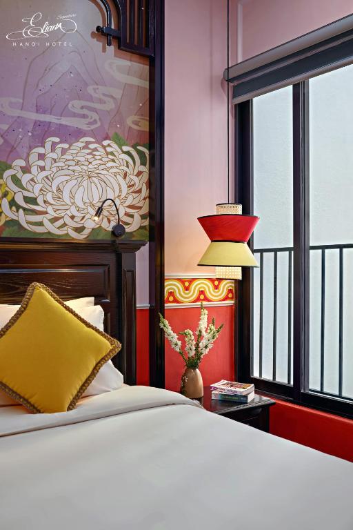 Postel nebo postele na pokoji v ubytování Eliana Signature Hanoi Hotel