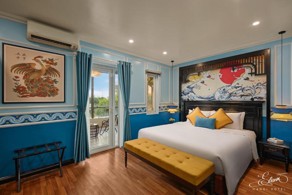 Postel nebo postele na pokoji v ubytování Eliana Signature Hanoi Hotel