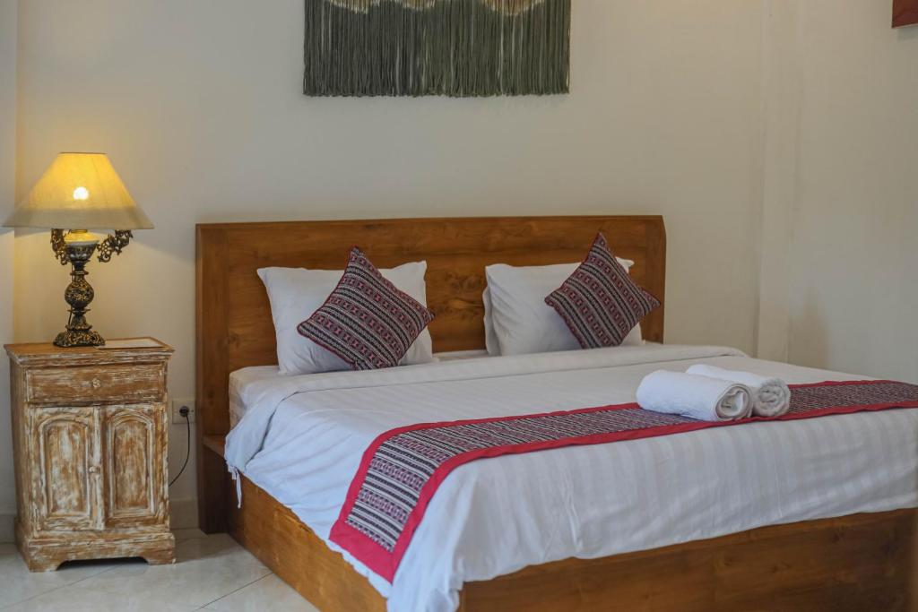 Postel nebo postele na pokoji v ubytování Shankara Accomodation Ubud
