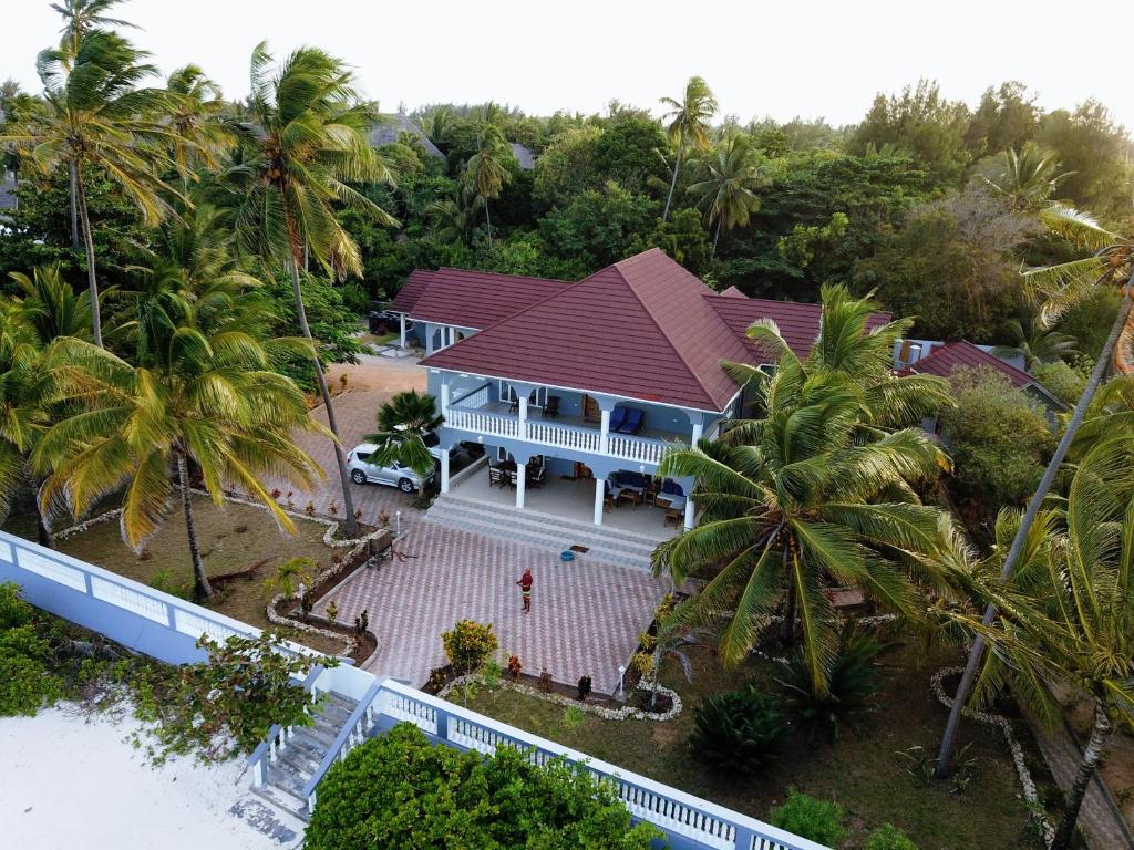 an aerial view of a house with palm trees at Villa Oman in Bwejuu