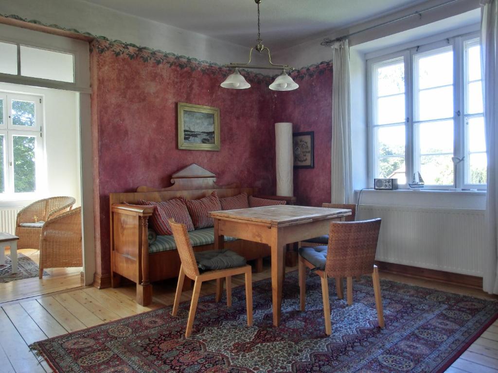 a living room with a wooden table and chairs at Strandstraße 60 Ferienwohnung S14 in Graal-Müritz