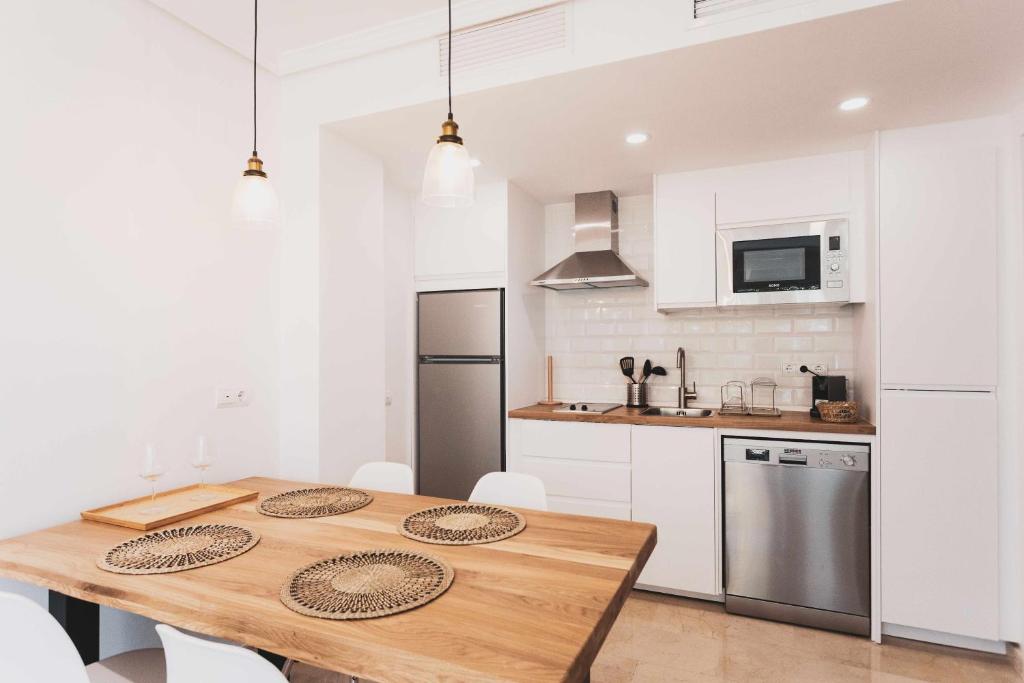 Kuchyň nebo kuchyňský kout v ubytování Precioso apartamento en primera línea de playa III