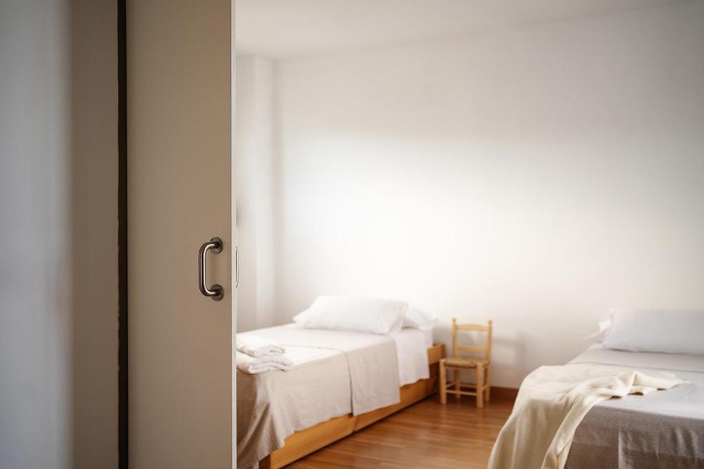 Postel nebo postele na pokoji v ubytování Casa2patis