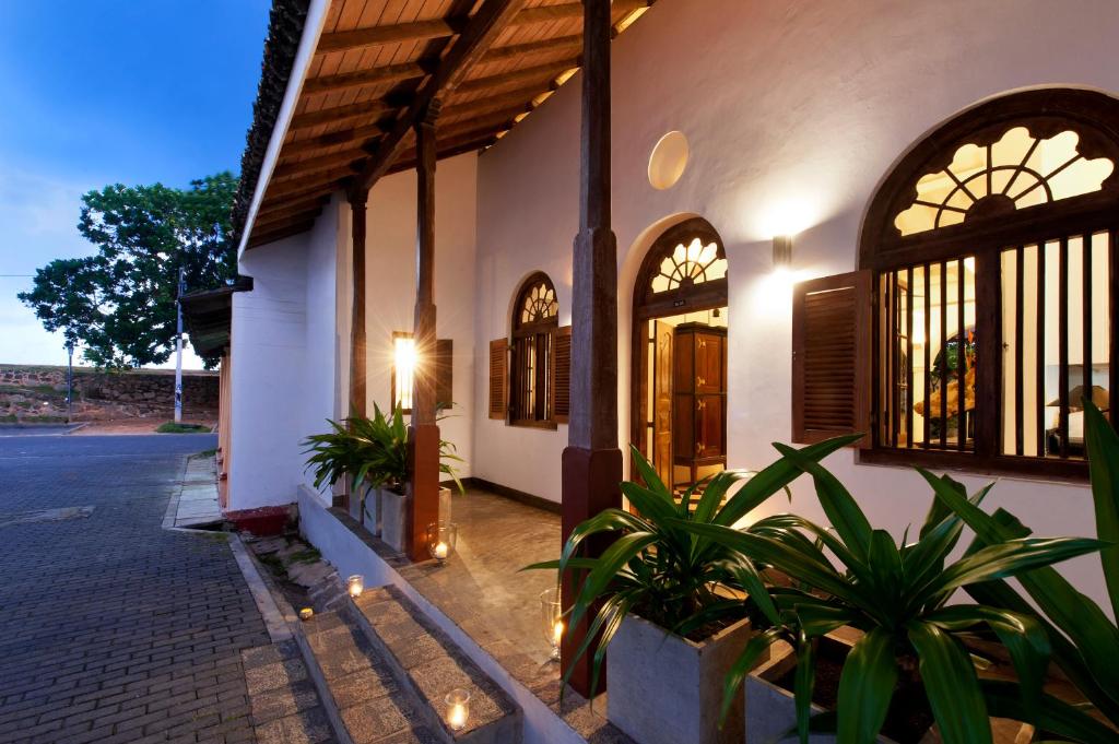 a building with some plants in front of it at A 03 Bedroom Villa in Galle Fort with Roof Terrace & Pool in Galle