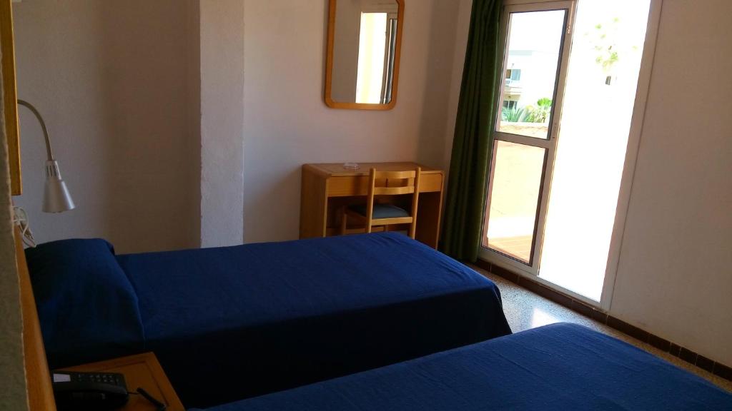 Postel nebo postele na pokoji v ubytování Hotel Bari