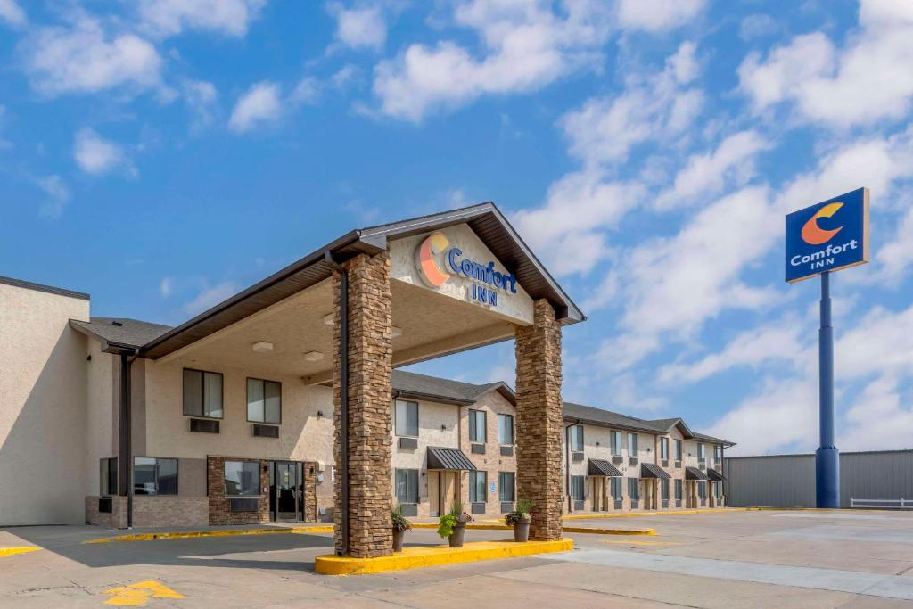 a hotel with a sign in front of a building at Comfort Inn Lexington in Lexington