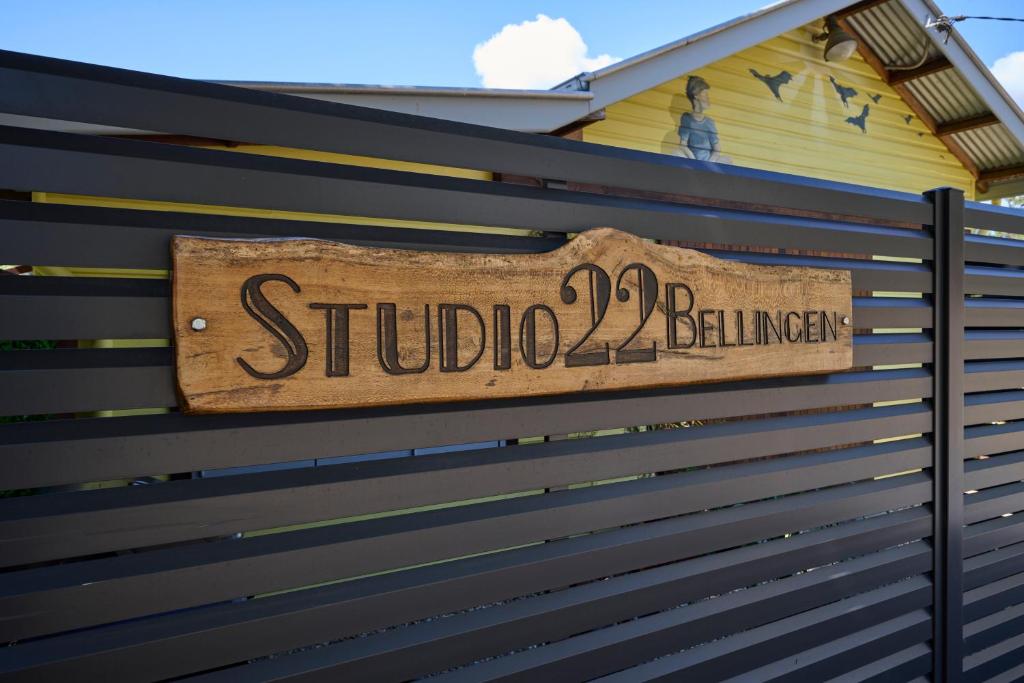 a sign on the side of a fence at Studio 22 Bellingen in Bellingen