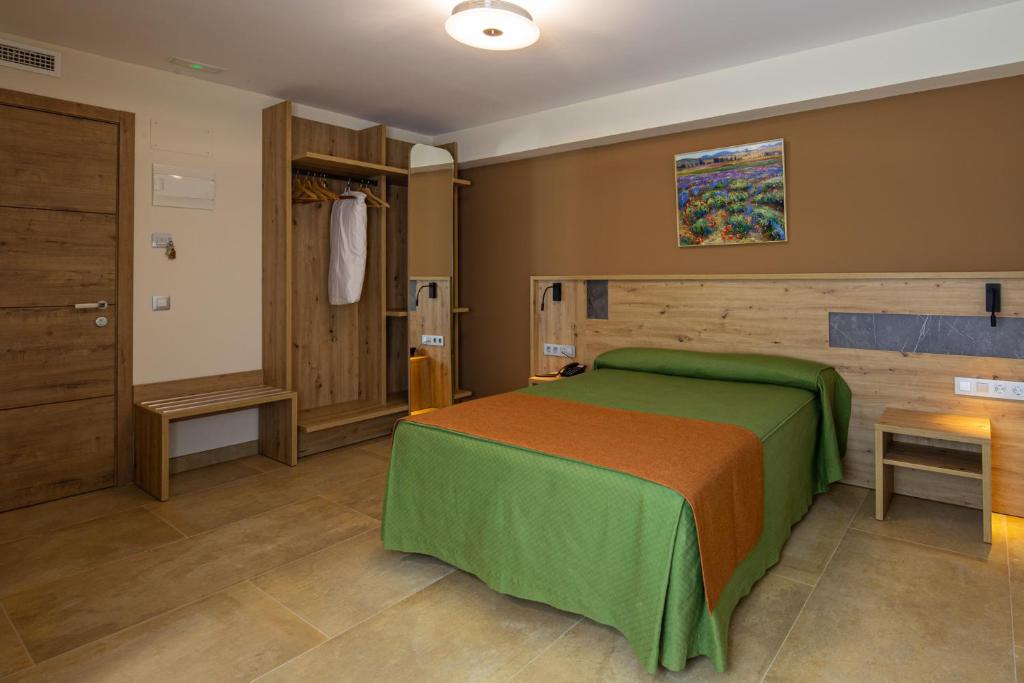 Postel nebo postele na pokoji v ubytování Hostal Las Grullas