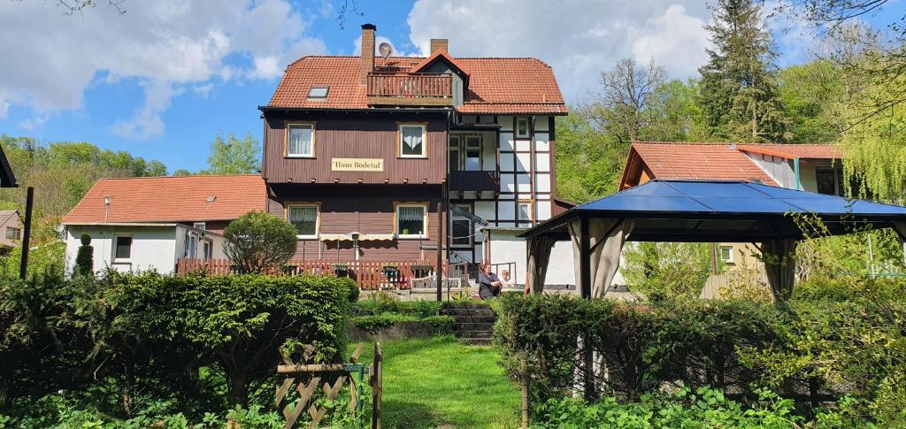 a large house with a gazebo in front of it at Haus Bodetal in Altenbrak