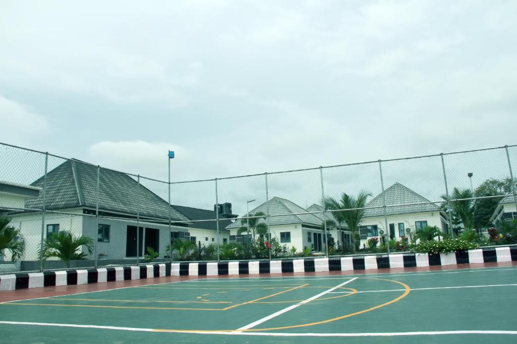 a basketball court in front of some houses at SILVERZB RESORT in Iseyin