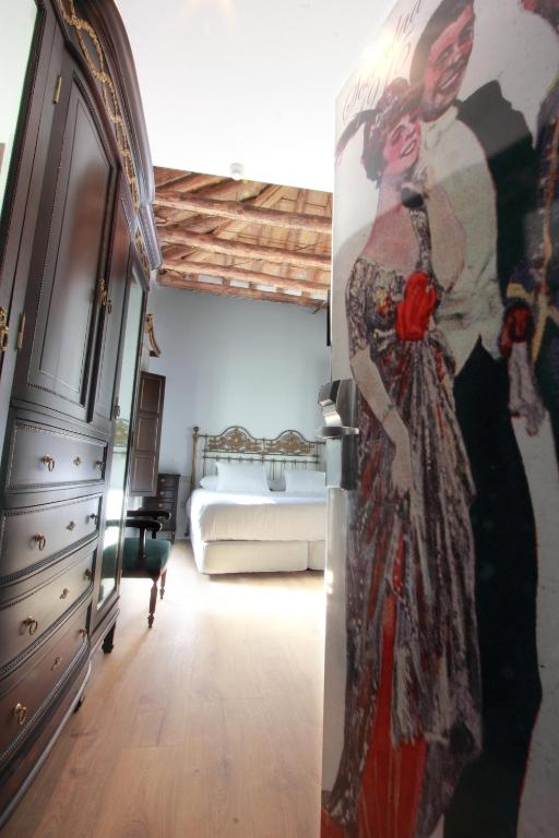A bed or beds in a room at Hotel Patria Chica