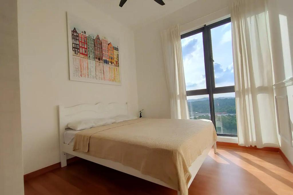 a bedroom with a bed and a large window at Budget Homestay by The RUM in Putrajaya