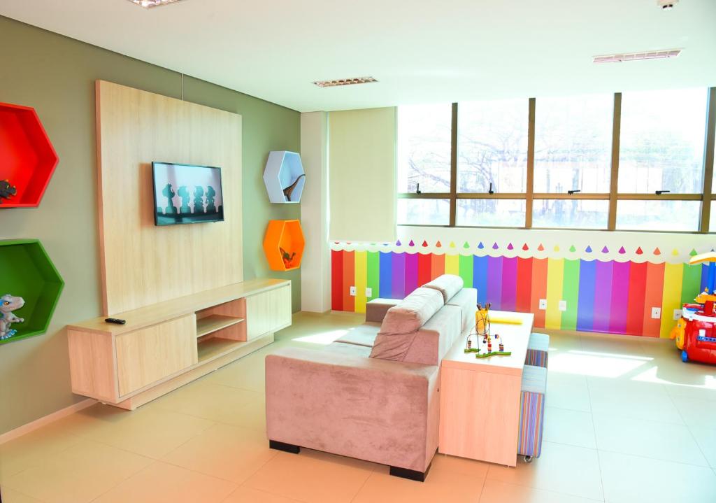 TV a/nebo společenská místnost v ubytování Hotel Plaza Garden