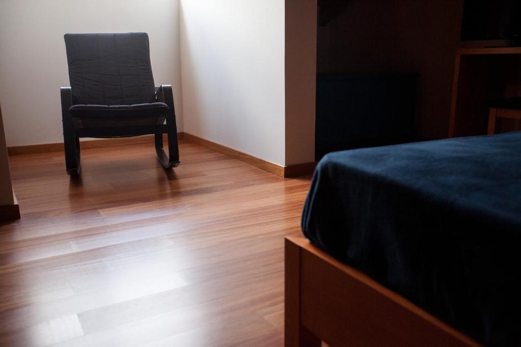 Postel nebo postele na pokoji v ubytování Pico da Saudade