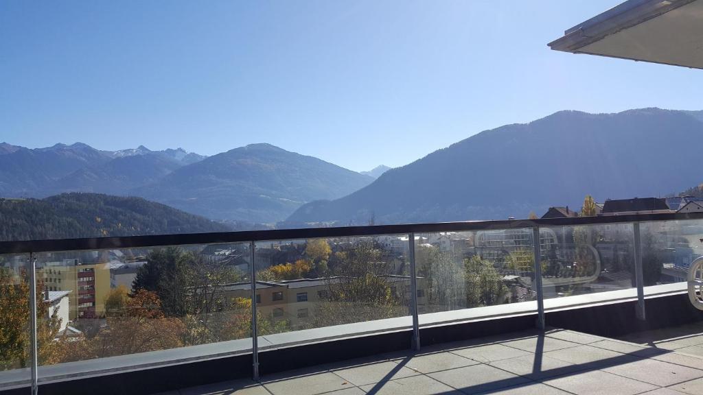 a view of a mountain range from a balcony at Penthouse in den Bergen in Imst