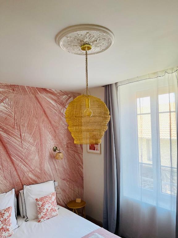 Postel nebo postele na pokoji v ubytování MAISON LE BEAULIEU