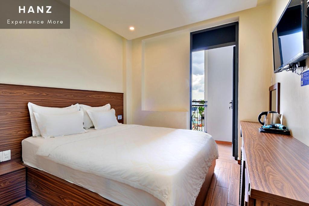Giường trong phòng chung tại HANZ Minh Thu Hotel Go Vap