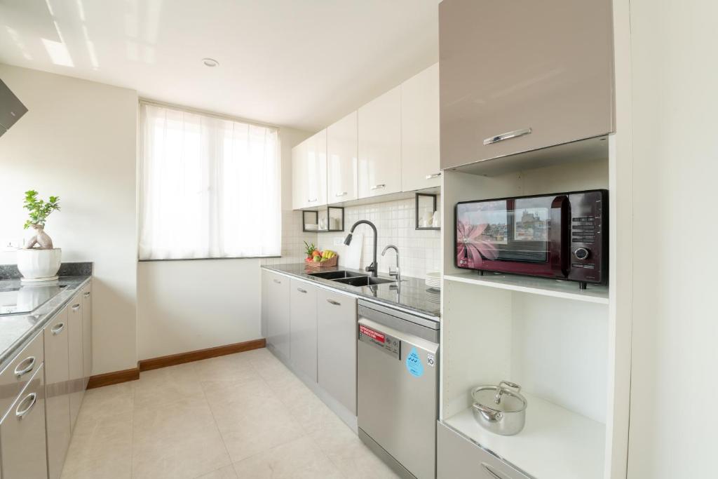Kuchyň nebo kuchyňský kout v ubytování Mila Hotel