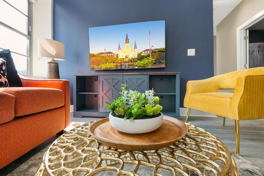 a living room with a couch and a table at NOLA Charm - Luxury 4-Bed Retreat Steps from French Quarter in New Orleans