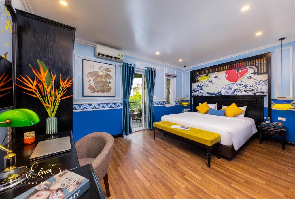 Postel nebo postele na pokoji v ubytování Eliana Signature Hanoi Hotel