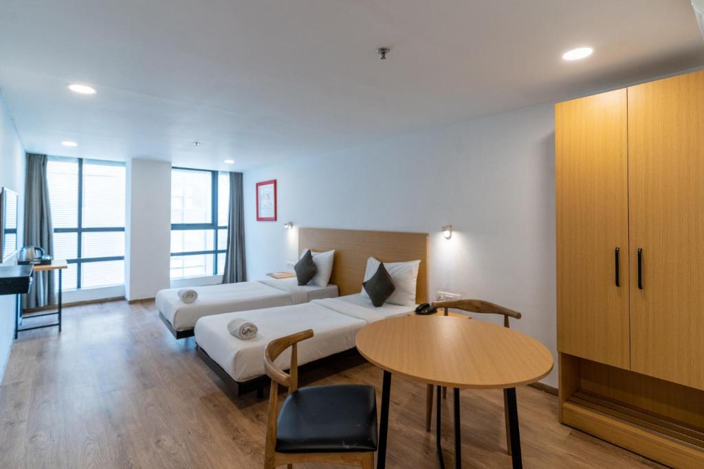 Postel nebo postele na pokoji v ubytování Hotel Sunflare