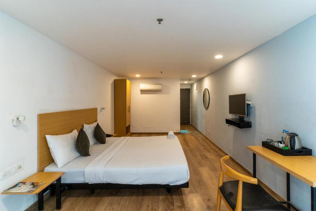 Postel nebo postele na pokoji v ubytování Hotel Sunflare