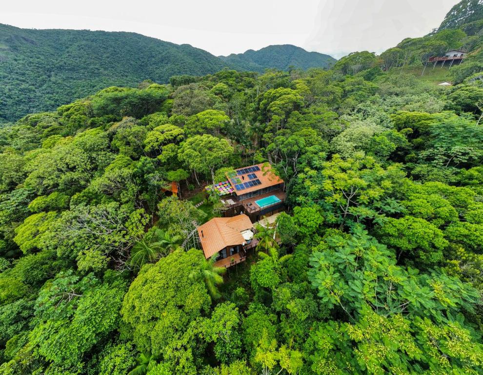 an aerial view of a house in the forest at Bulegreen Cabanas in Santo Amaro da Imperatriz