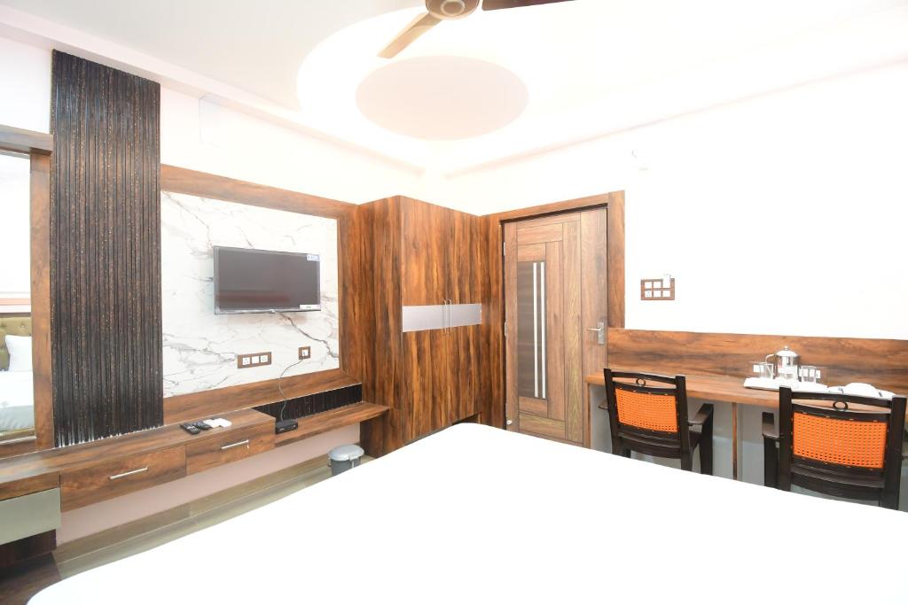 Postel nebo postele na pokoji v ubytování HOTEL SUSHREE INTERNATIONAL