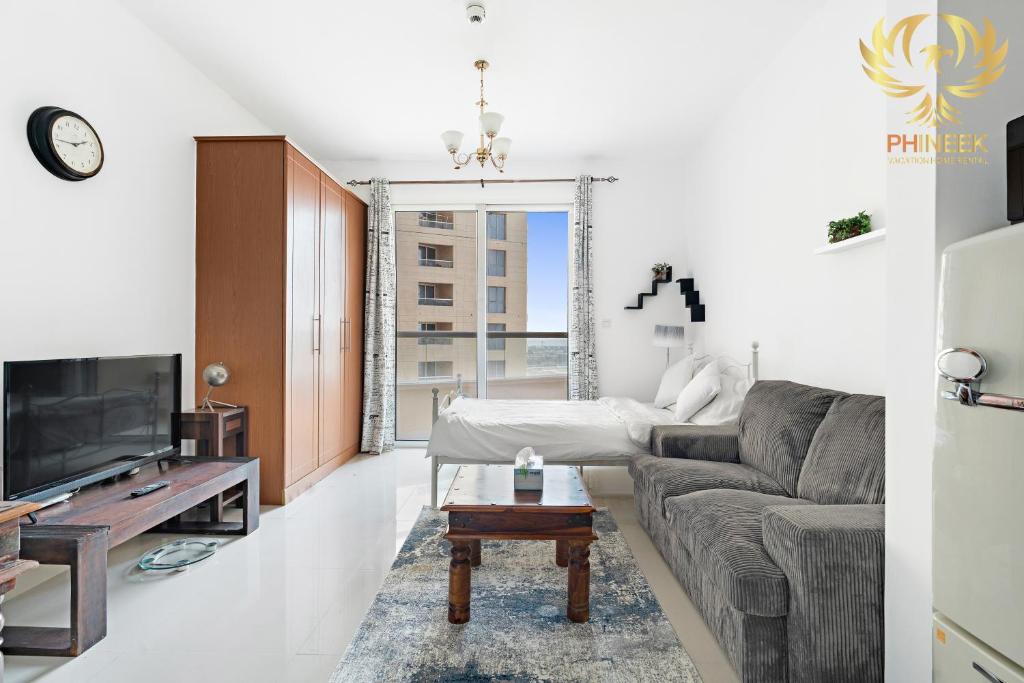 Phineek Homes Elegant Studio Lake Side IMPZ Production City, Dubai