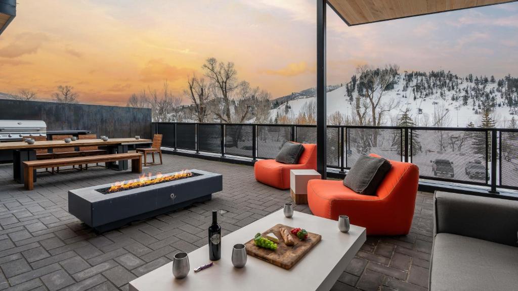 a living room with a view of a snowy mountain at Butterfly Lofts - West in Steamboat Springs