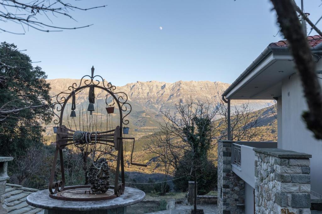 a bird feeder with a view of a mountain at Orminia ground level 