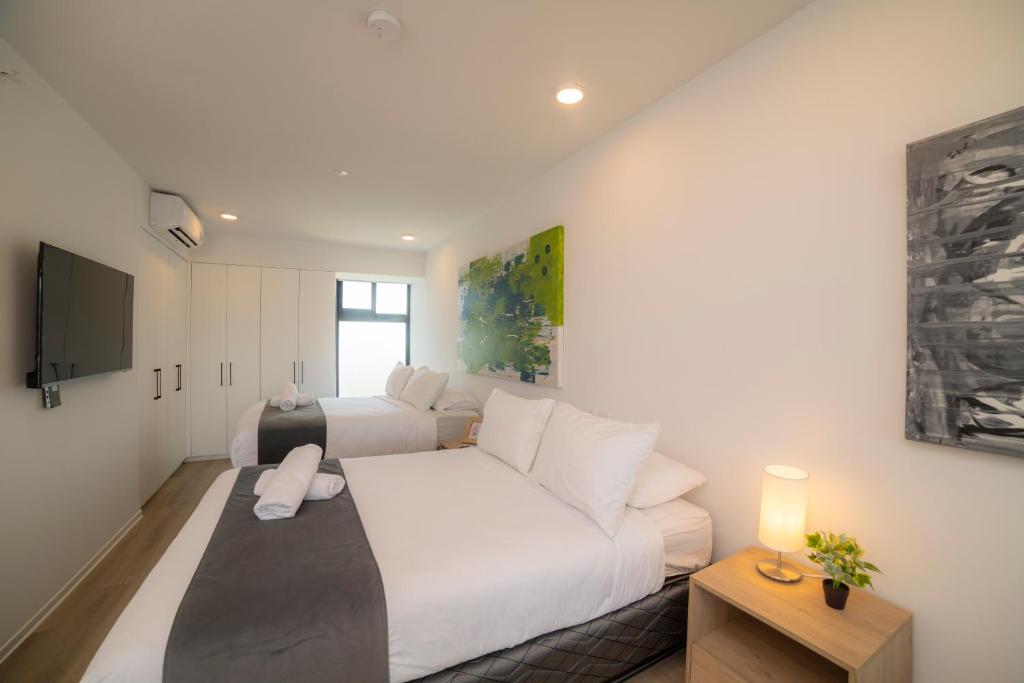 TV a/nebo společenská místnost v ubytování BEE Suites San José - Escalante