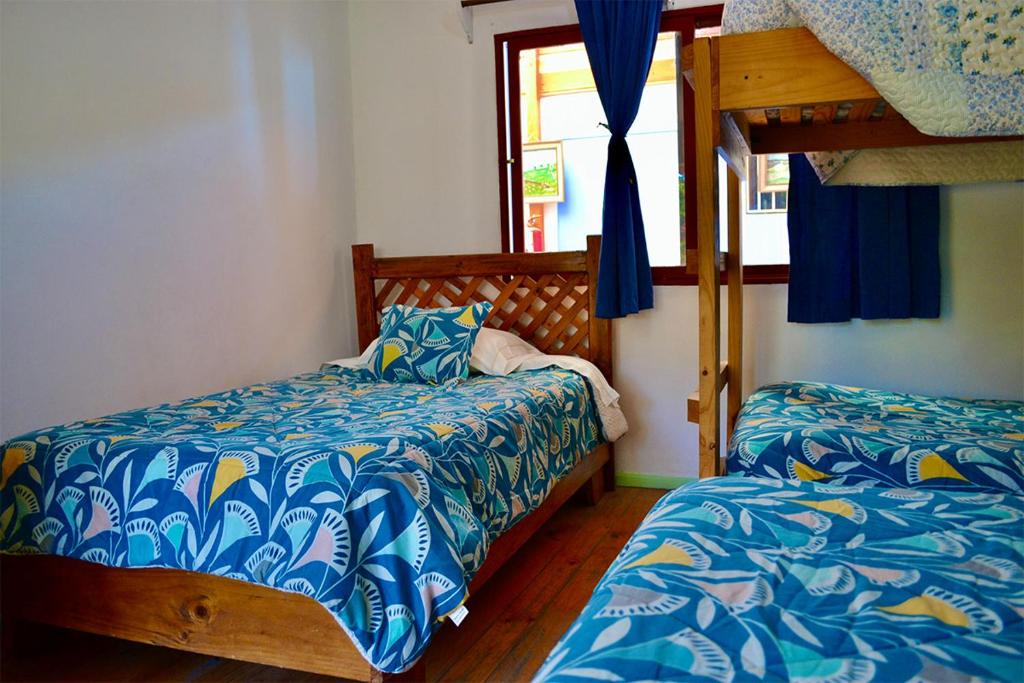 Postel nebo postele na pokoji v ubytování Hostal Michel